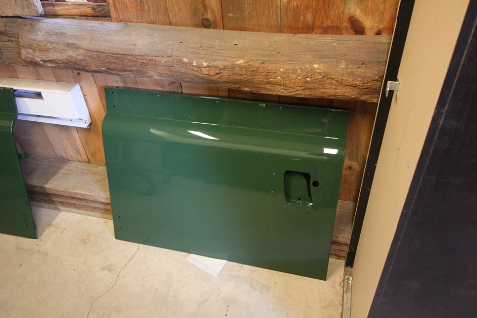 New genuine Land Rover doors are repainted in Conniston Green Glasurit.