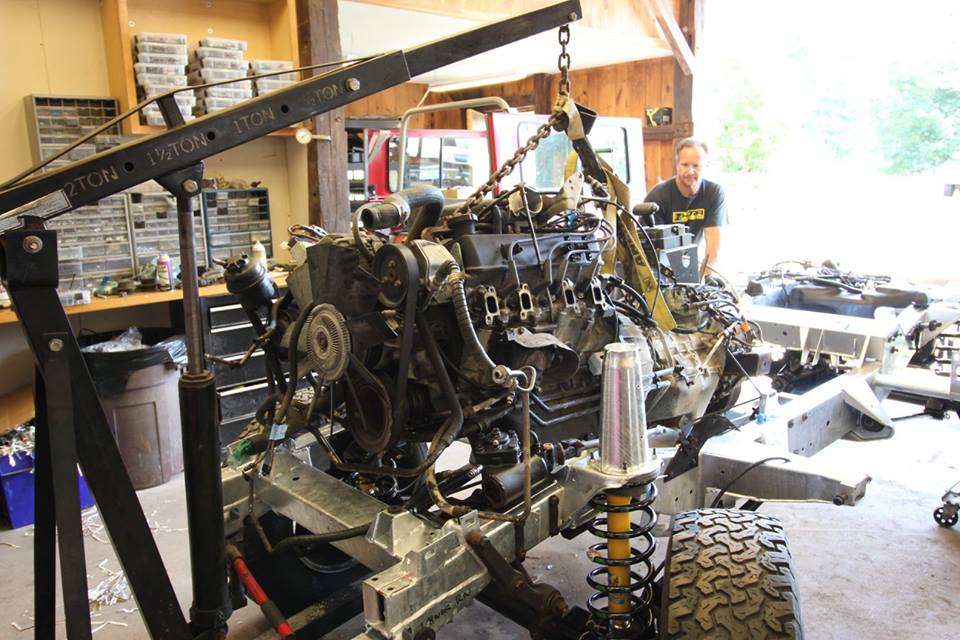 The drivetrain is reinstalled into the rolling chassis.