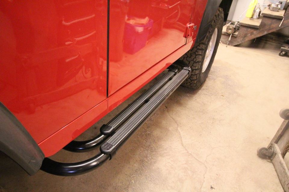 New genuine Land Rover side steps are installed.