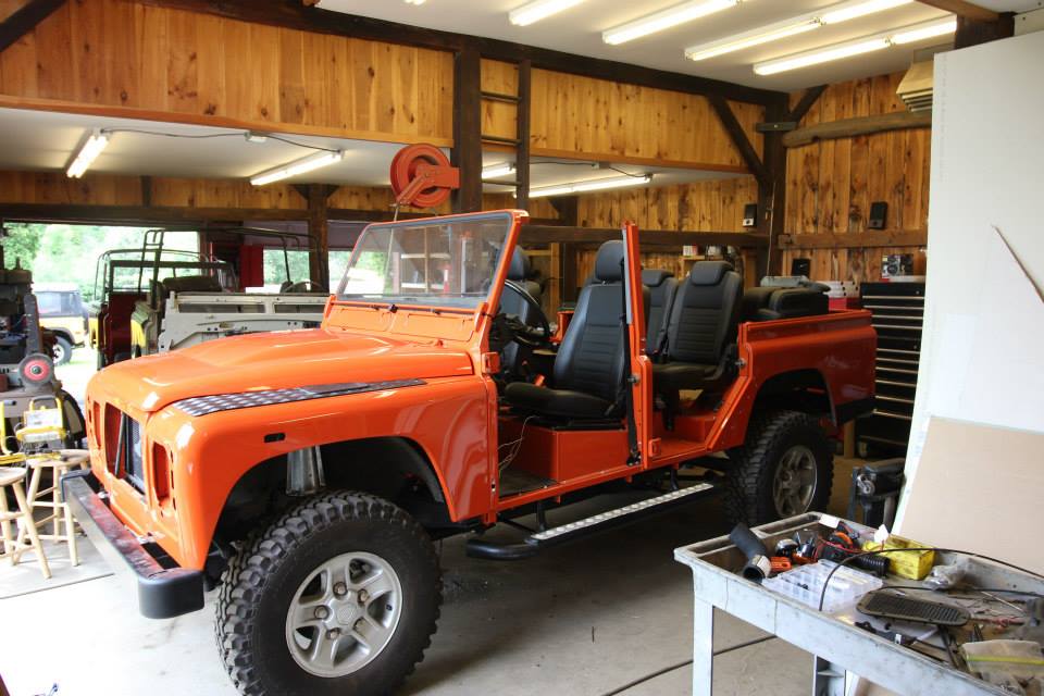 Body assembly in progress on a 1988 Land Rover Defender.