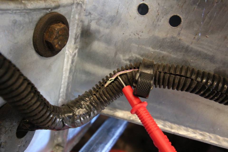 A cut in the fuel pump wire is discovered in the wiring harness.