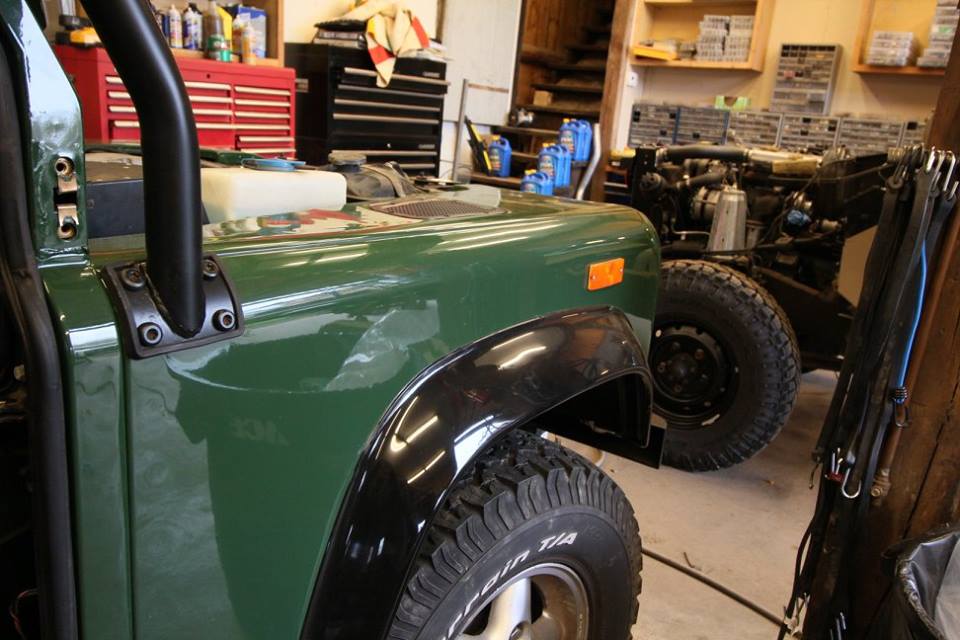 New genuine Land Rover fender flares are installed.