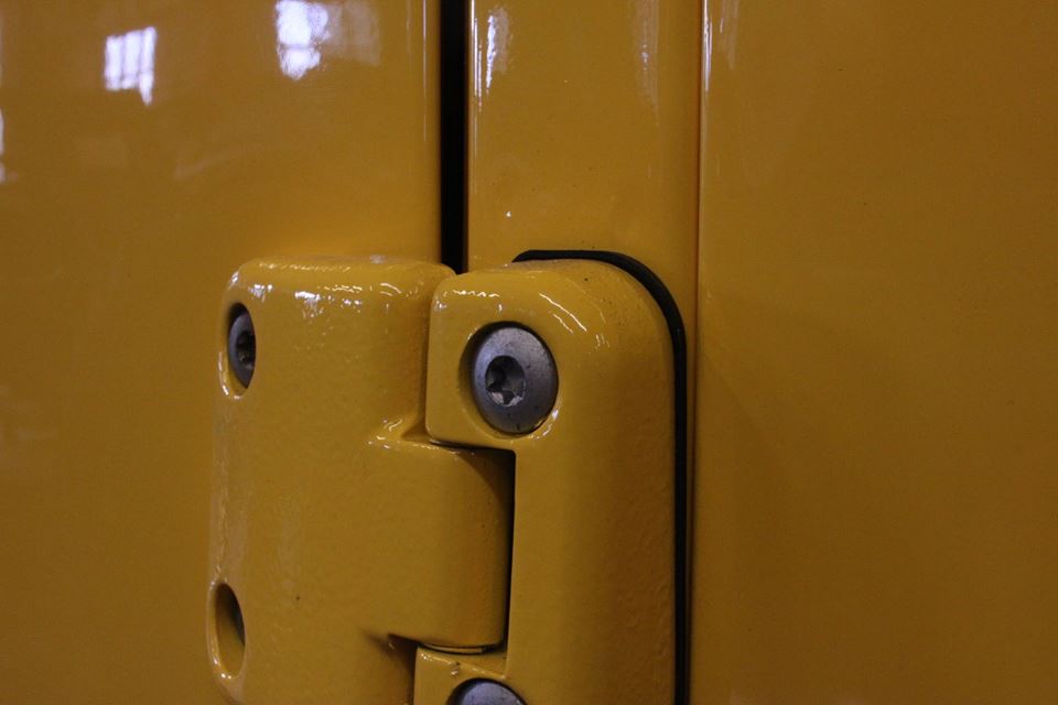 New style rust-resistant genuine Land Rover door hinges are installed with galvanized hardware.