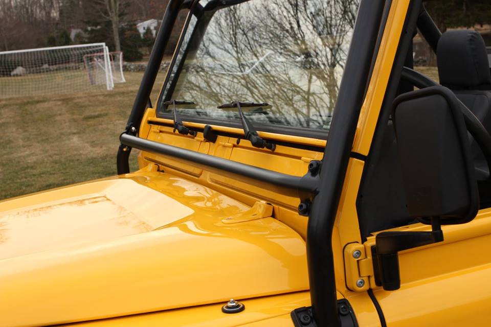 The external roll cage is powder coated and installed.