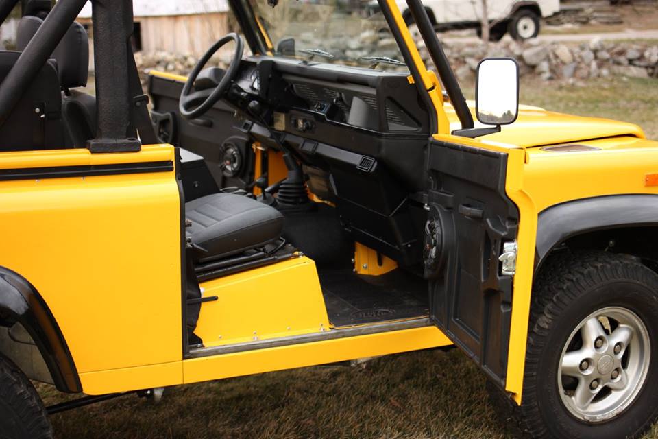 A new genuine Land Rover floor mat is installed. All the carpeting has been replaced with rubber mats.