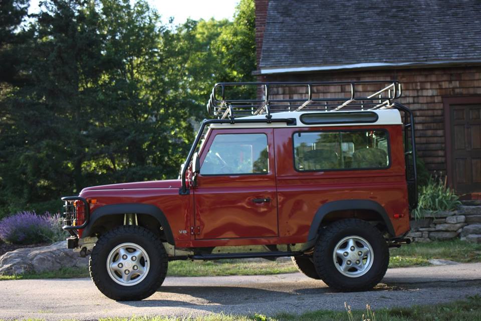 The Land Rover looks remarkable for having its original paint.