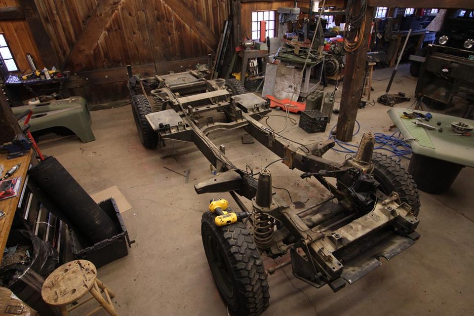 The Land Rover is stripped to the bare frame and the body parts disassembled for paint.